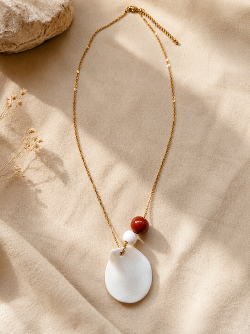 Astro · Collar de porcelana